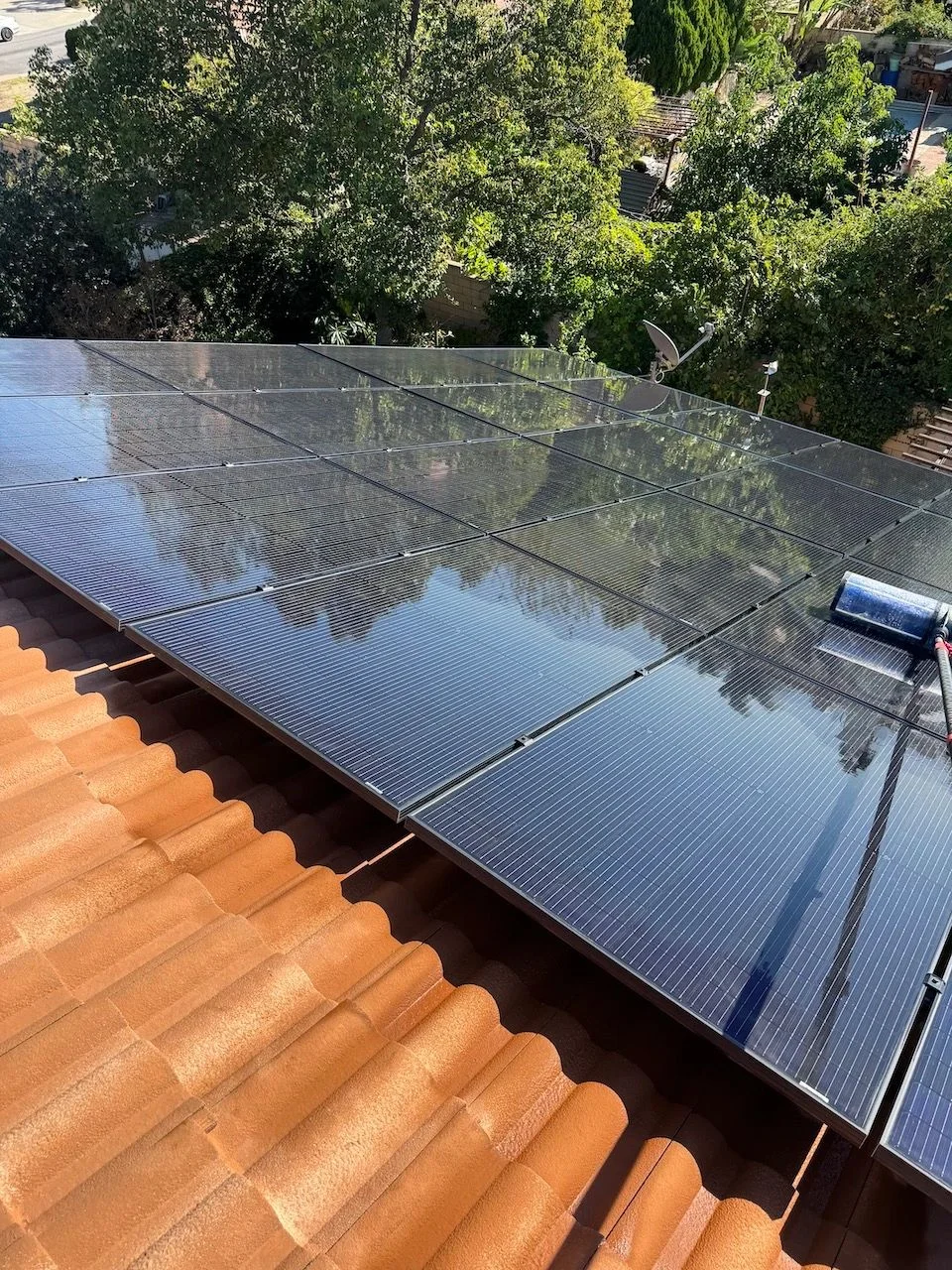 Reflective panels on a residential roof