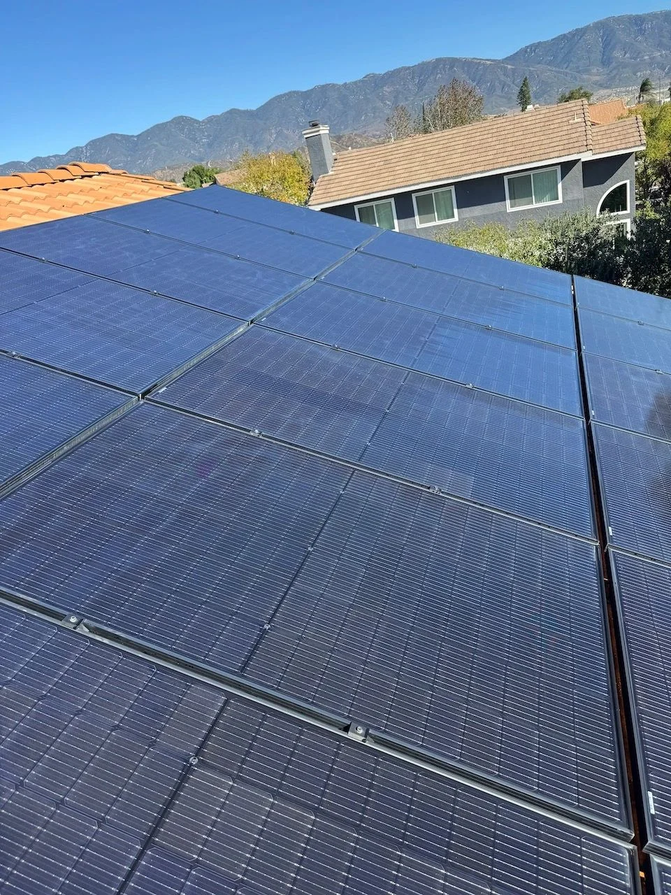 Clean solar panels reflecting the sky — original business project photo