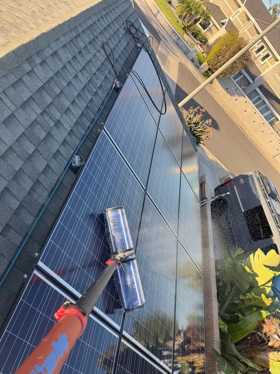 Solar panel cleaning in progress — actual business photo